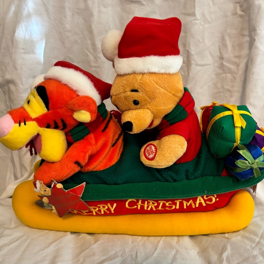 Vintage Pooh and Tigger musical sleigh.